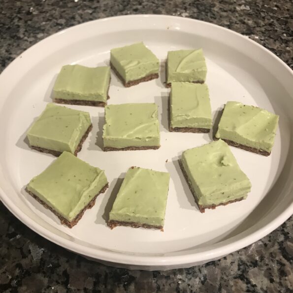 key lime pie bars on a white dish
