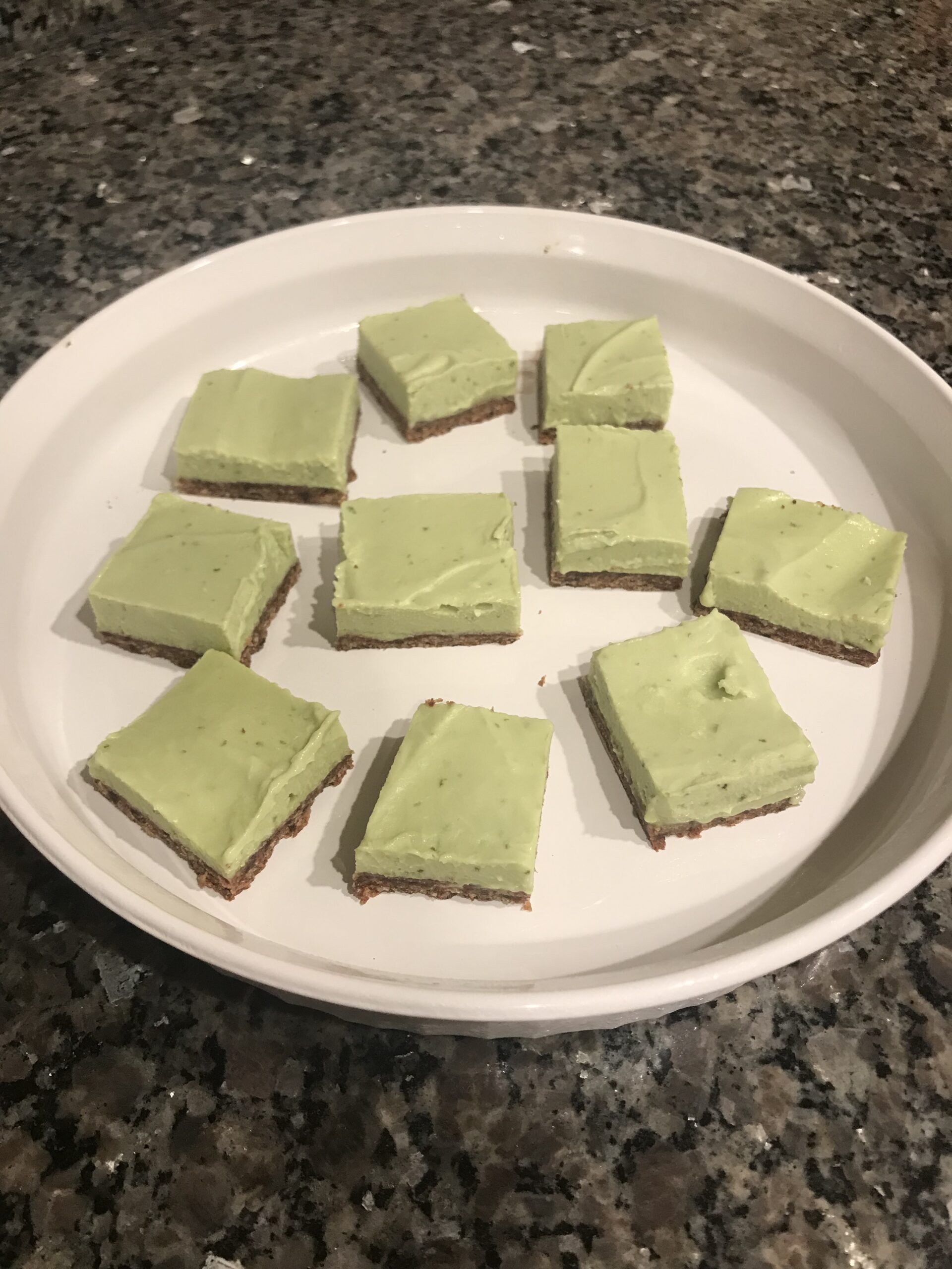 key lime pie bars on a white dish